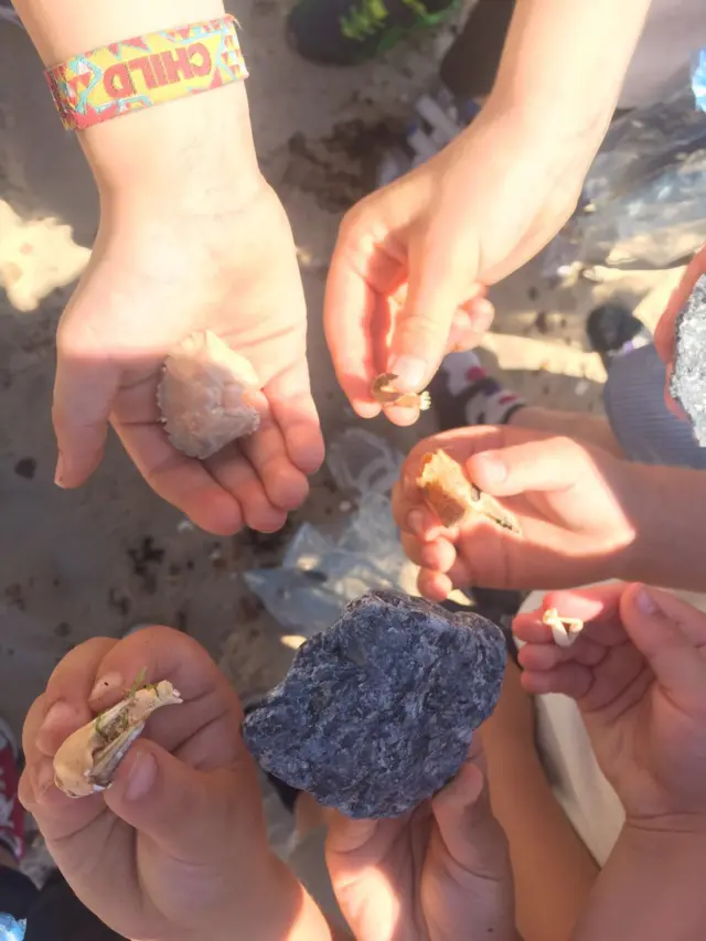 Children showing off what they've found