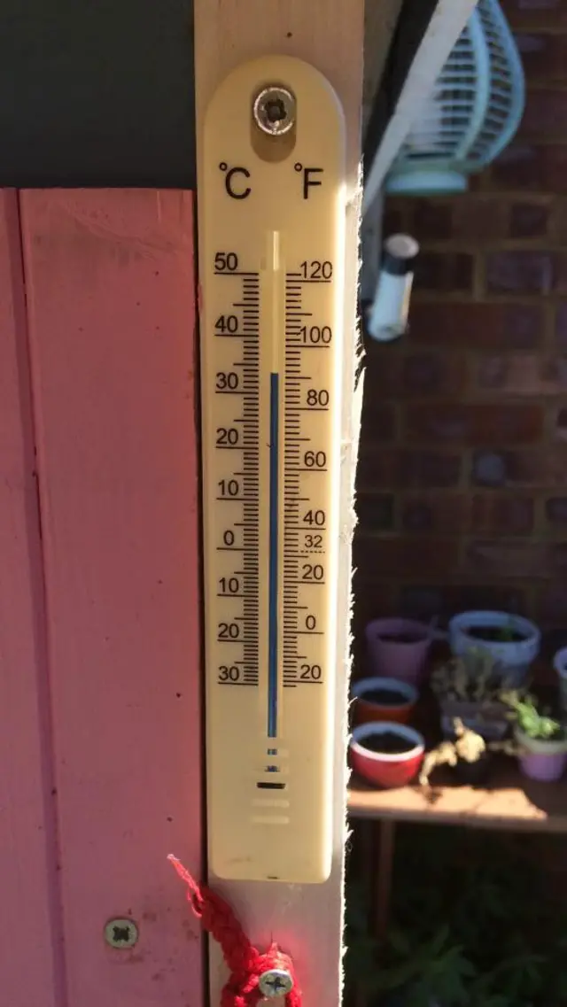 A thermometer showing temperature in the mid-thirties