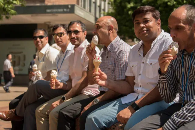 Men eating ice cream