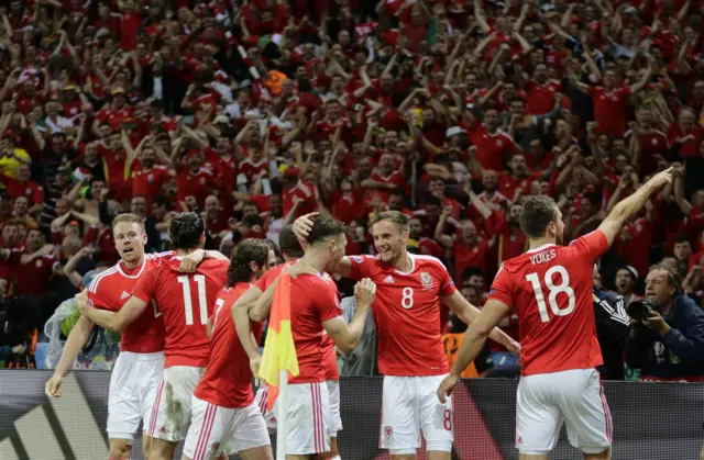 Wales celebrate after the third goal from Sam Vokes