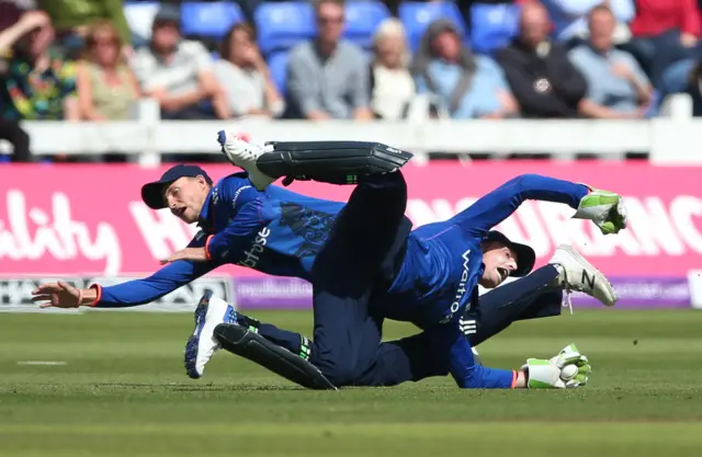 Joe Root and Jos Buttler in the field