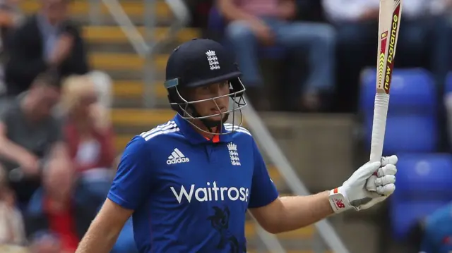 Joe Root celebrates his 50