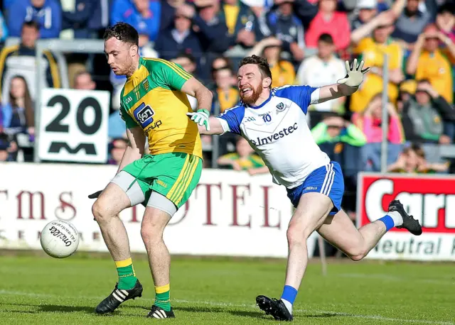 Donegal's Martin McElhinney in action against Owen Duffy of Monaghan