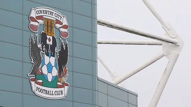 Coventry City badge on side of stadium