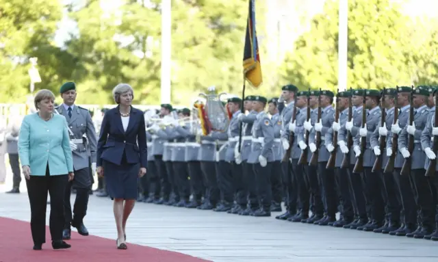 Theresa May receives ceremonial welcome in Berlin