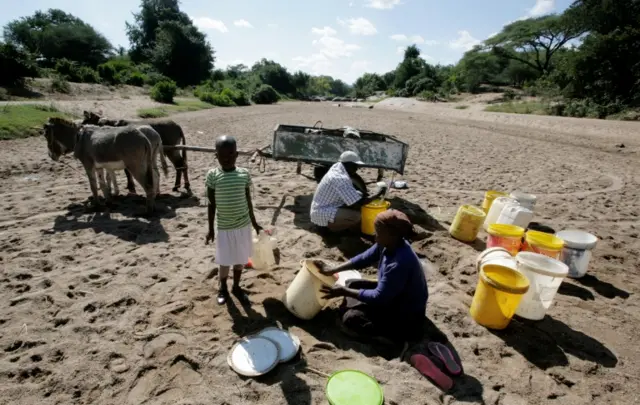 Villagers collect water from a dry river bed in drought hit Masvingo last month