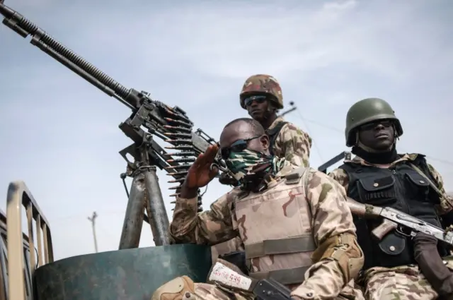 This file photo taken on March 25, 2016 shows soldiers from the 7th Division of the Nigerian Army on the back of a vehicle in Damboa, Borno State northeast Nigeria