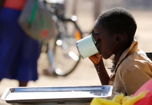 A child drinks water from a cup in drought-hit Masvingo, Zimbabwe, June 1, 2016.