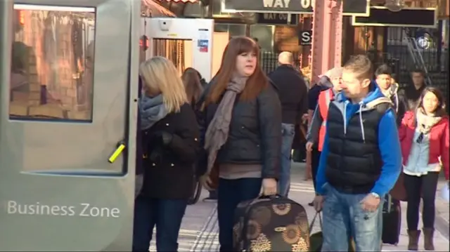 People getting onto a train