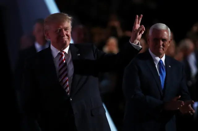 Mr Trump is pictured with his running mate, Mike Pence, at the Republican Convention