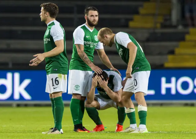 John McGinn is comforted by by his team-mates