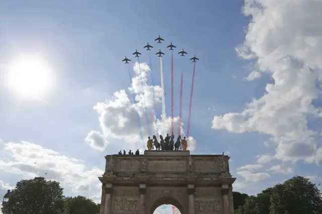 Jets with the Patrouille de France fly in formation