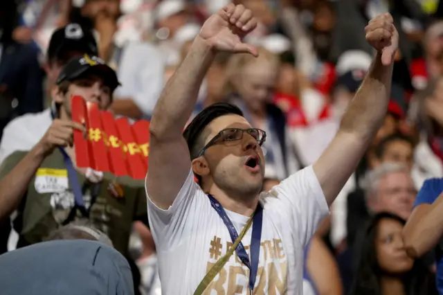 A delegates gestures while chanting during the opening of the first day of the Democratic National Convention.