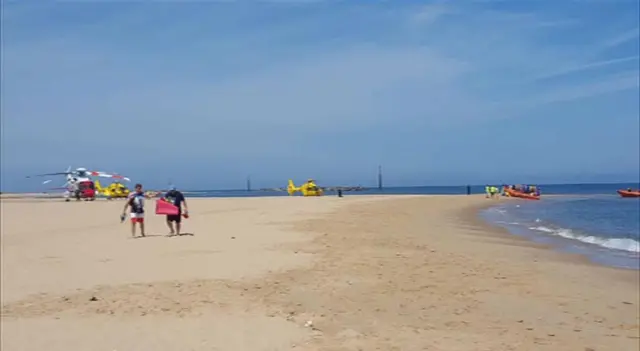 Air Ambulances on Sea Palling beach, with rescue workers