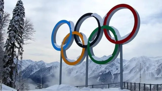 Olympics rings logo in snowy mountains