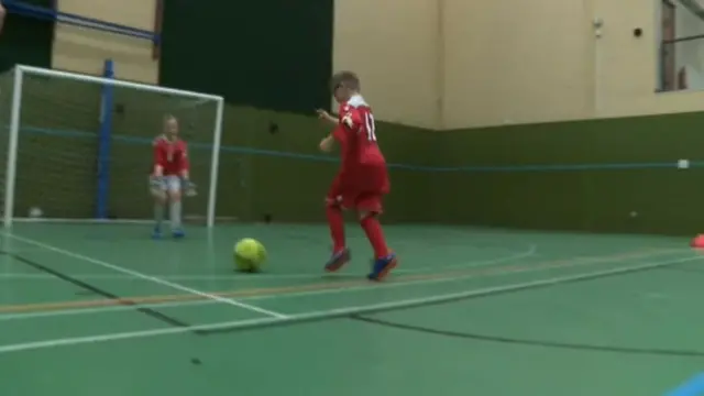 Youngsters playing football