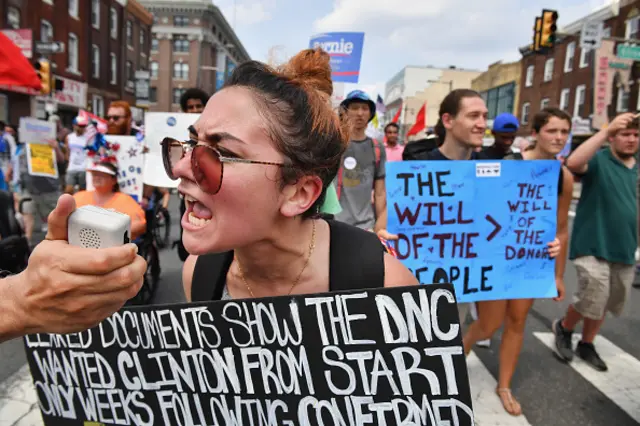 Bernie Sanders supporters march in the heat through the streets of Philadelphia.