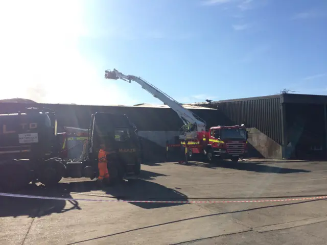 Fire engines including aerial ladder at the agricultural building