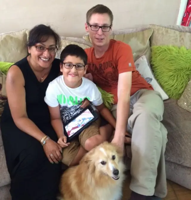 Harminder and Gary Rann with son Kyle and their pet dog