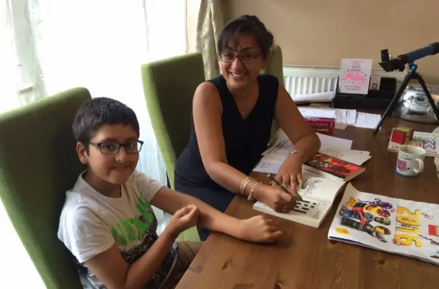 Harminder and Kyle doing lessons at home