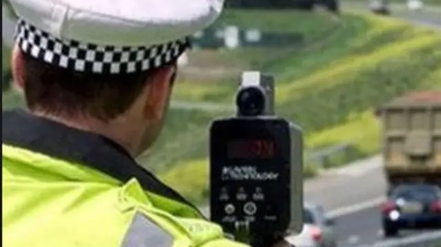 Policeman with speed gun