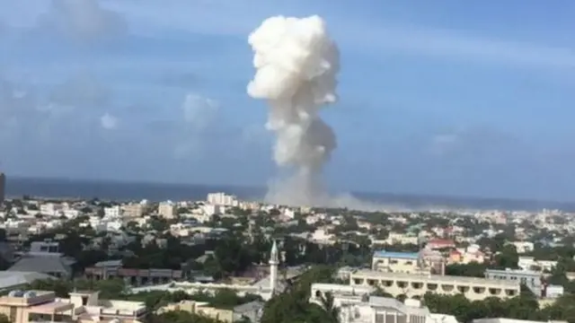 A large plume of smoke rose into the sky after the blasts