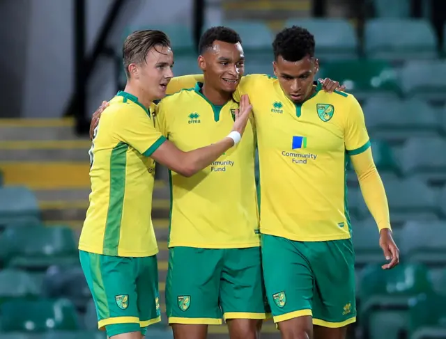 Jacob Murphy (centre) with twin brother Jordan Murphy (right) and James Maddison (left)