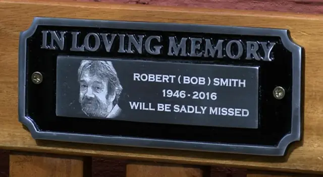 An inscription on a coffin in tribute to Bob Smith