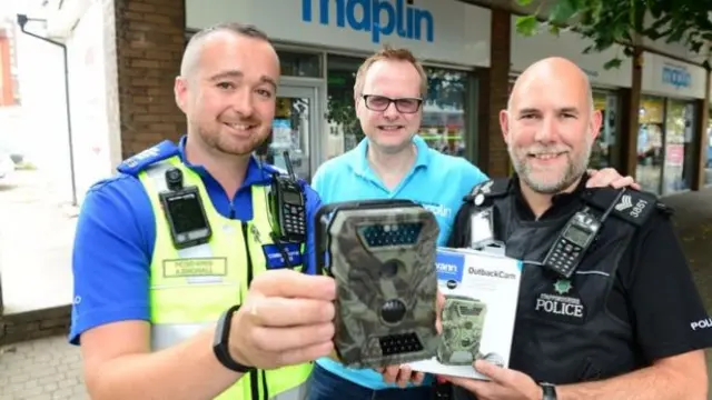 PCSO Andrew Bagnall, store manager Daniel Hassall and Sergeant Dave Fenton