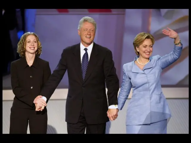 The Clintons and daughter Chelsea wave to the crowd following a speech at the Democratic National Convention in Los Angeles in 2000