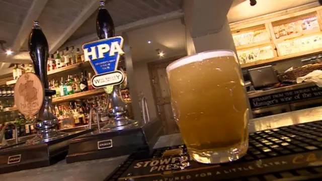 Glass of beer on bar