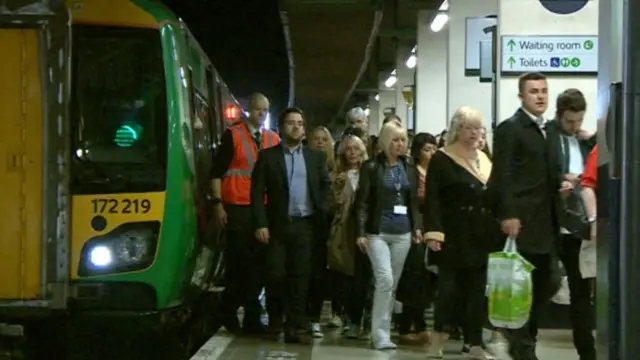 Passengers getting off a train