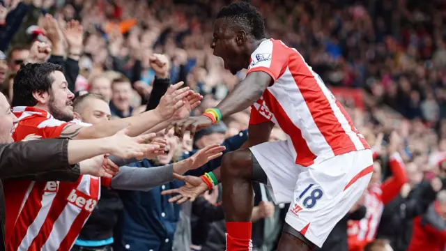 Mame Biram Diouf of Stoke City celebrates scoring with fans