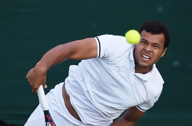 Jo-Wilfried Tsonga serves