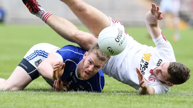 Cavan's Rory Dunne and Niall Sludden of Tyrone the the deck at Clones