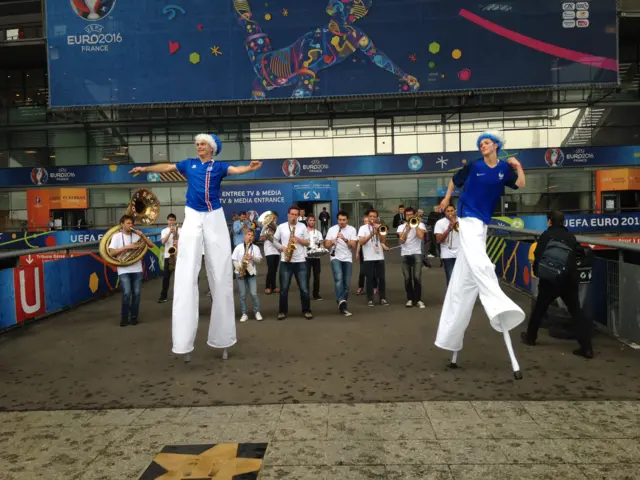 Dancers on stilts outside the Stade de France