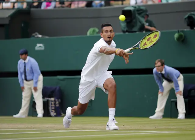 Nick Kyrgios plays a backhand