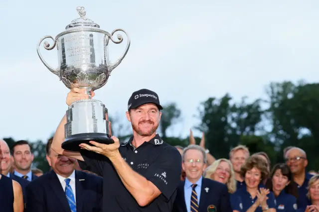 Jimmy Walker lifts the US PGA trophy