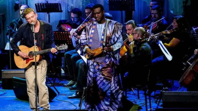 Damon Albarn performs with The Orchestra of Syrian Musicians