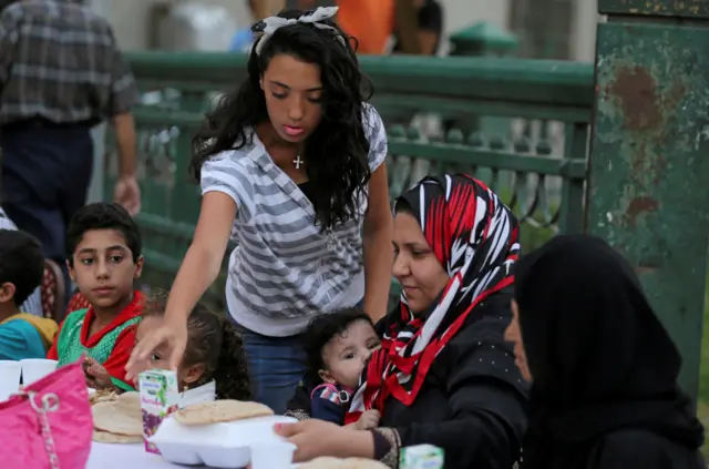 Young woman serving food