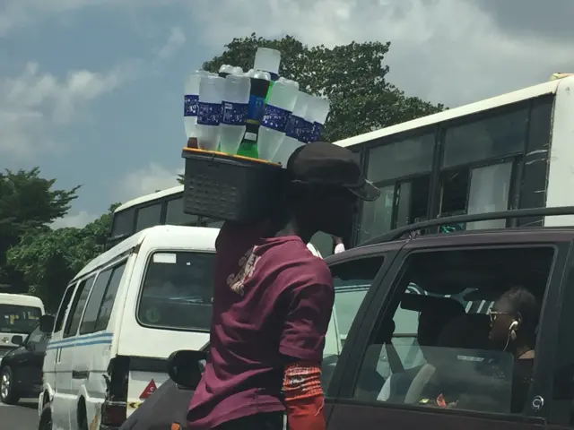 Street hawker selling water