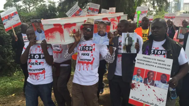 People holding holding a mock funeral to police killings in Kenya