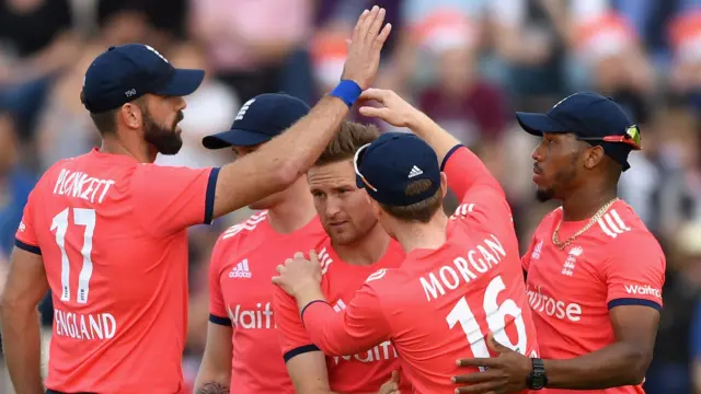 England's players celebrate a wicket