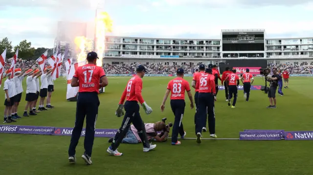 England's players come onto the field