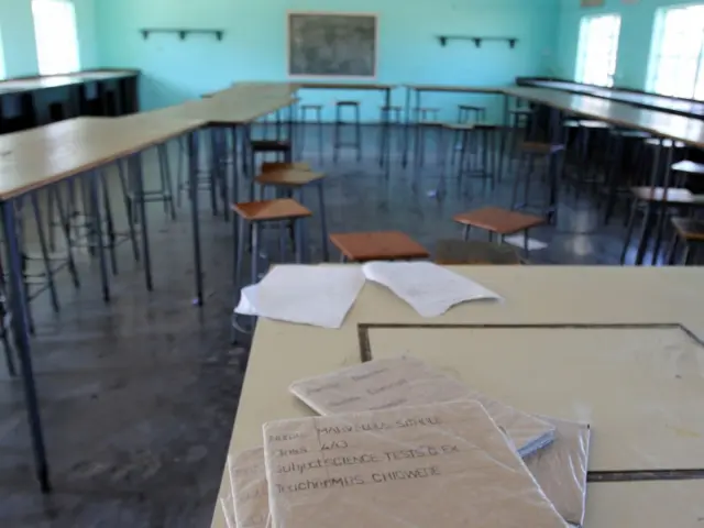 Books are seen in an empty classroom at a school near Harare, Zimbabwe