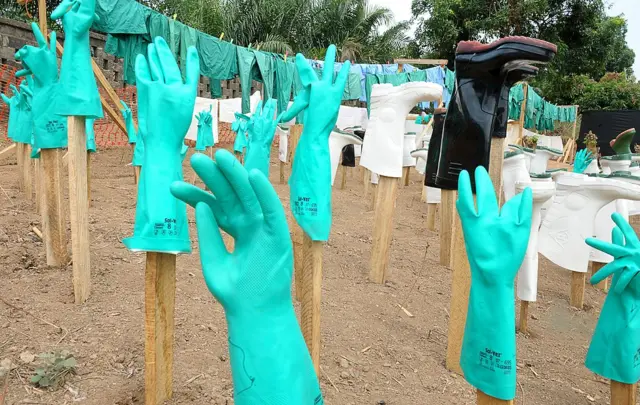 Gloves and boots used by medical staff, drying in the sun