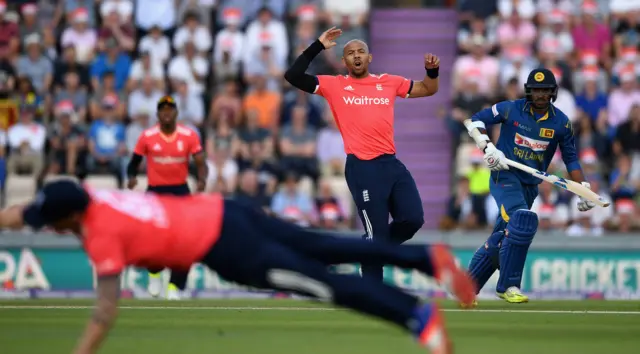 Tymal Mills reacts as the ball goes wide of a fielder