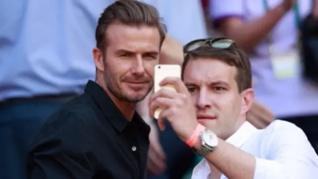 David Beckham with a Wimbledon spectator