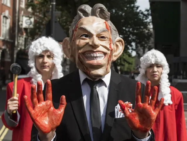 Protesters outside the Queen Elizabeth II conference centre