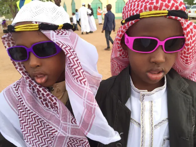 Boys dressed up in sunglasses and headdresses in Garissa, Kenya